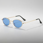 Sunglasses with gold frame and blue lenses on a white background
