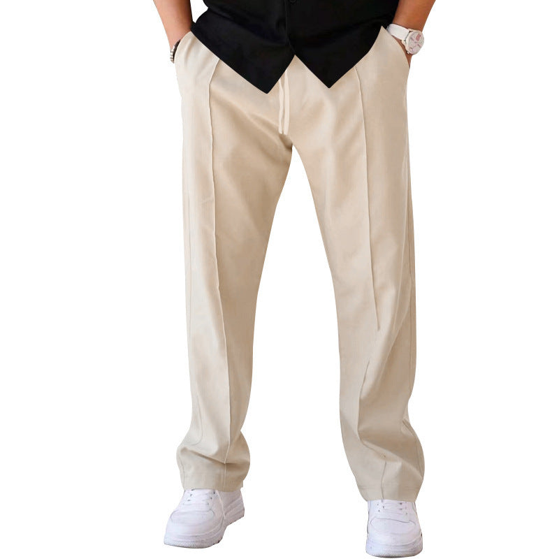 Men wearing sports casual loose straight pants with drawstring waist and waffle polyester fabric