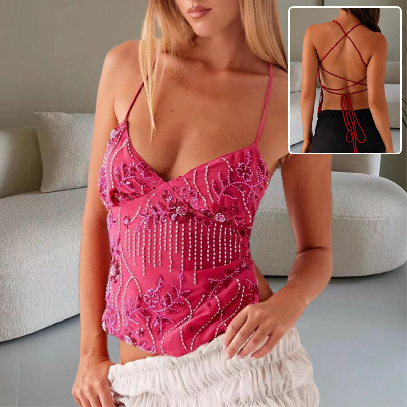 Woman wearing Y2K dopamine colored bandeau sling top with V neck and flower beaded backless design